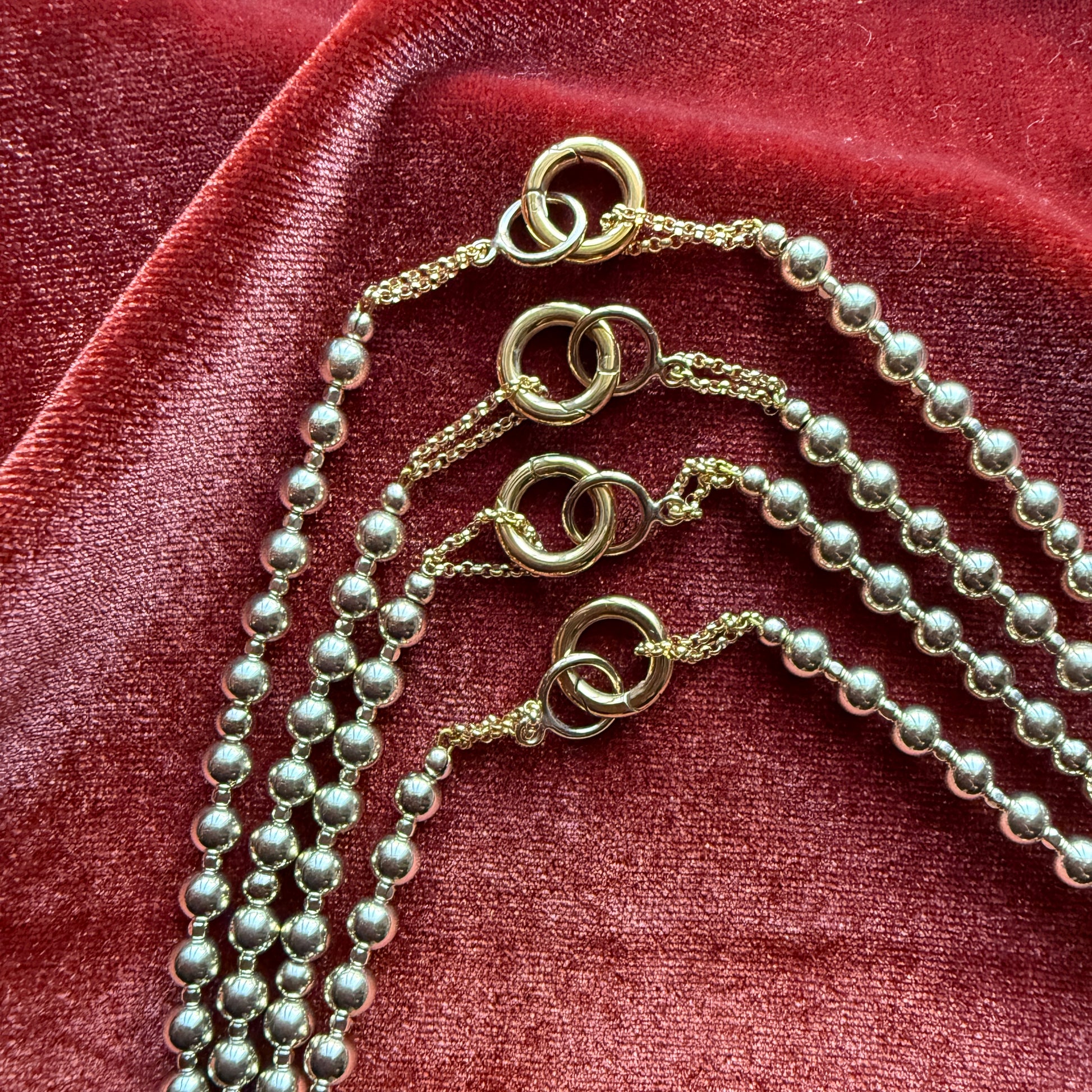 group of gold-filled beaded necklaces