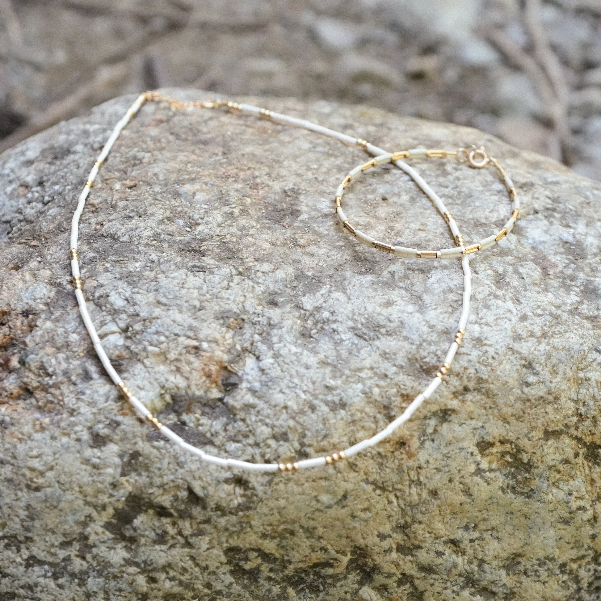 white beaded necklace with white beaded bracelet