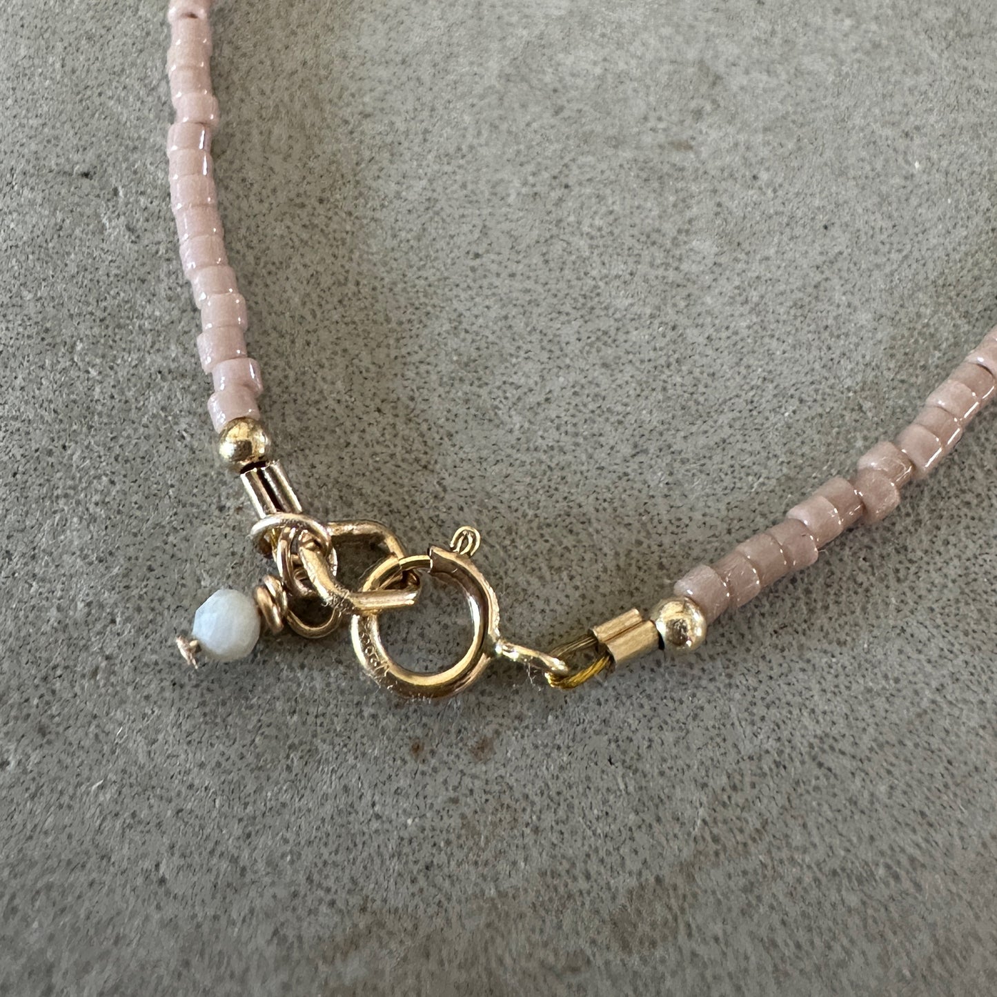 gold-filled clasp with an Australian opal accent charm on a bracelet with Japanese glass seed beads