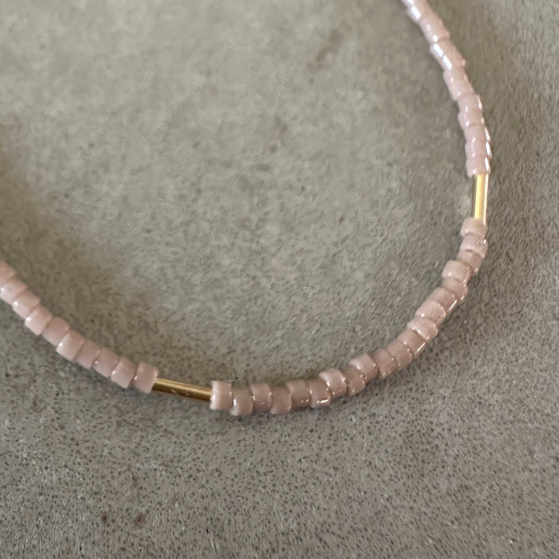 close up view of Japanese seed beads with gold-filled tube beads on a bracelet