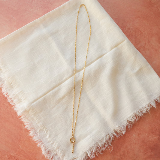 gold-filled chain necklace with circle front clasp and dangling gold-filled beaded accent