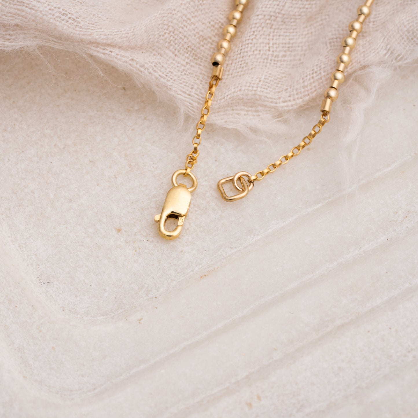 lobster clasp on a necklace with gold fill beads