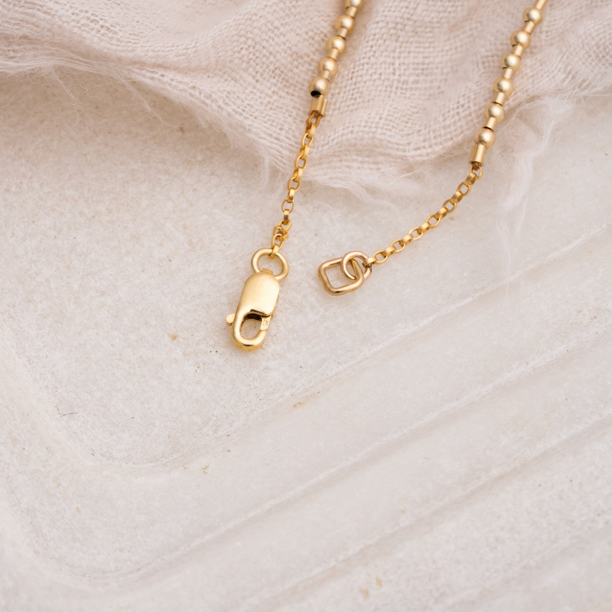 lobster clasp on a necklace with gold fill beads
