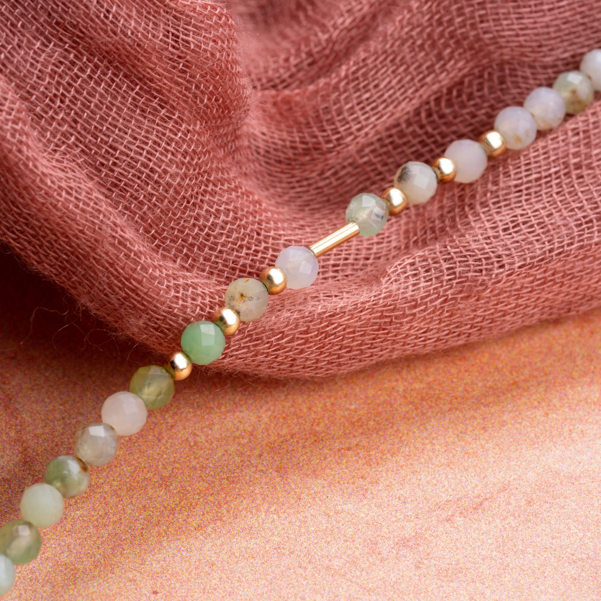 close-up of Chrysoprase stones and gold-filled beads