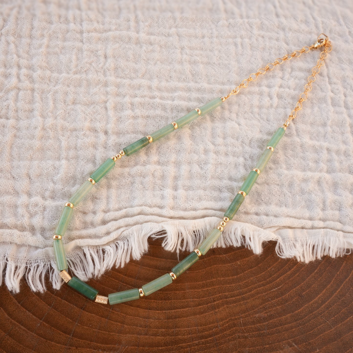 necklace with Aventurine tube beads on a white cloth