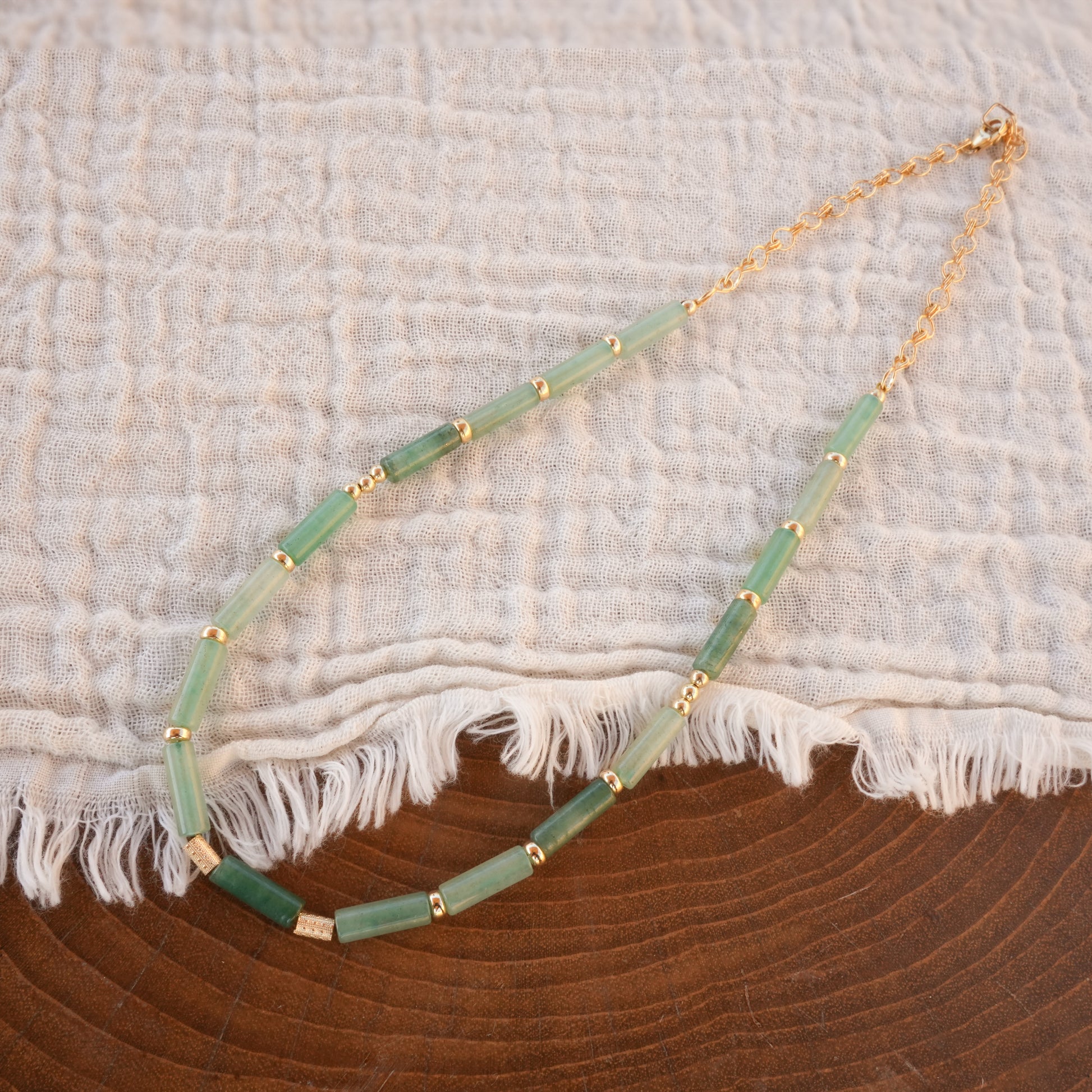 necklace with Aventurine tube beads on a white cloth
