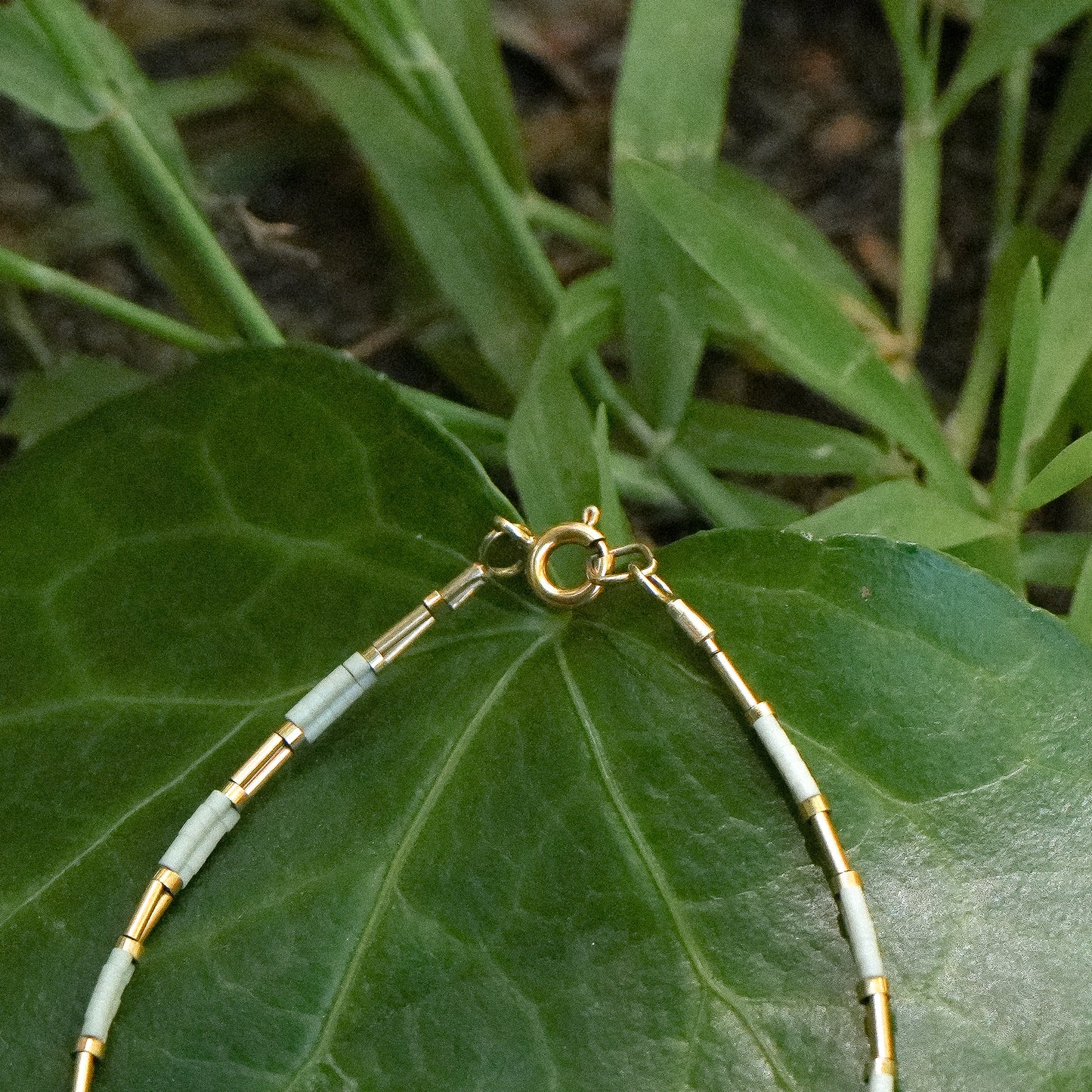 bracelet with Japenese glass beads and gold-filled beads on a leaf