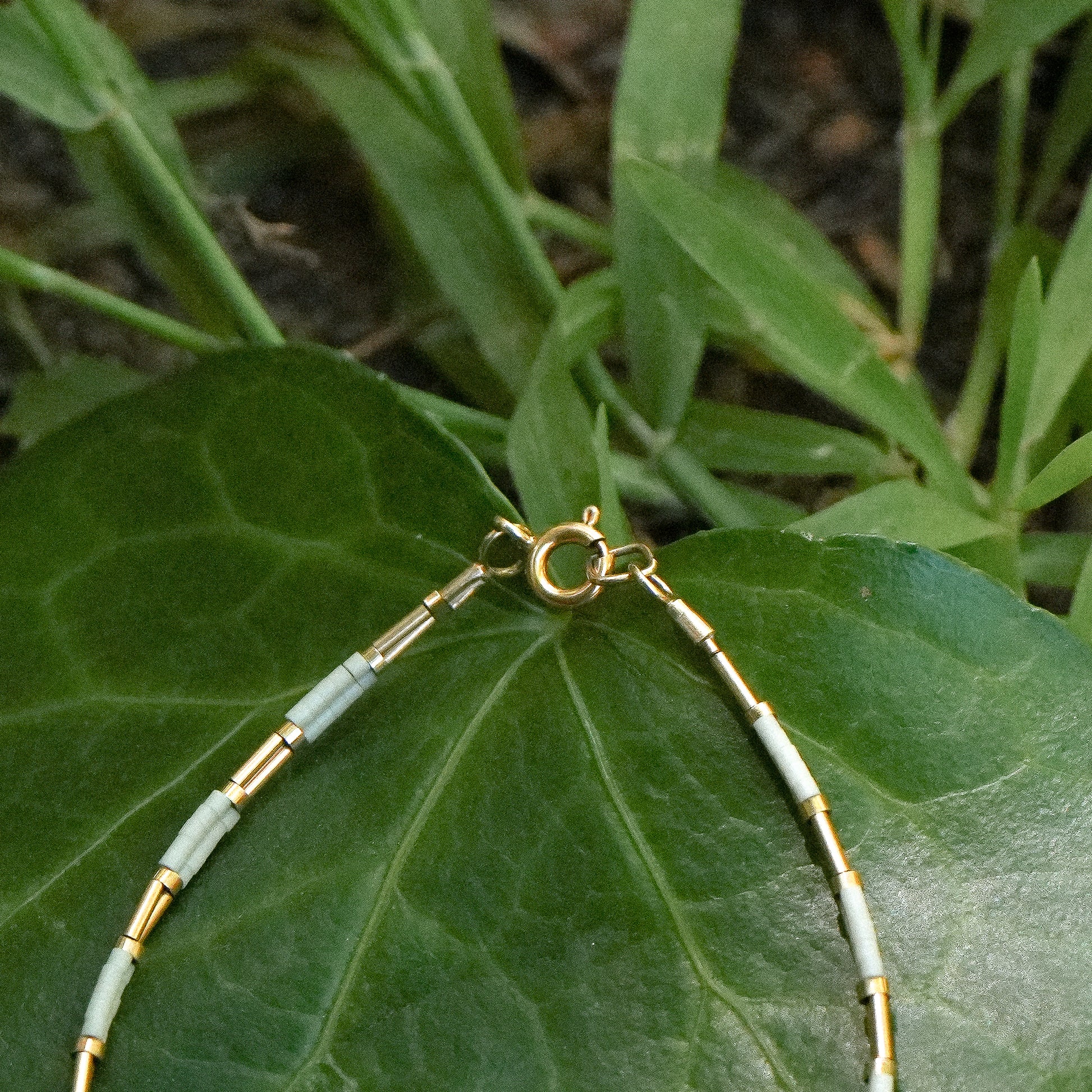 bracelet with Japenese glass beads and gold-filled beads on a leaf