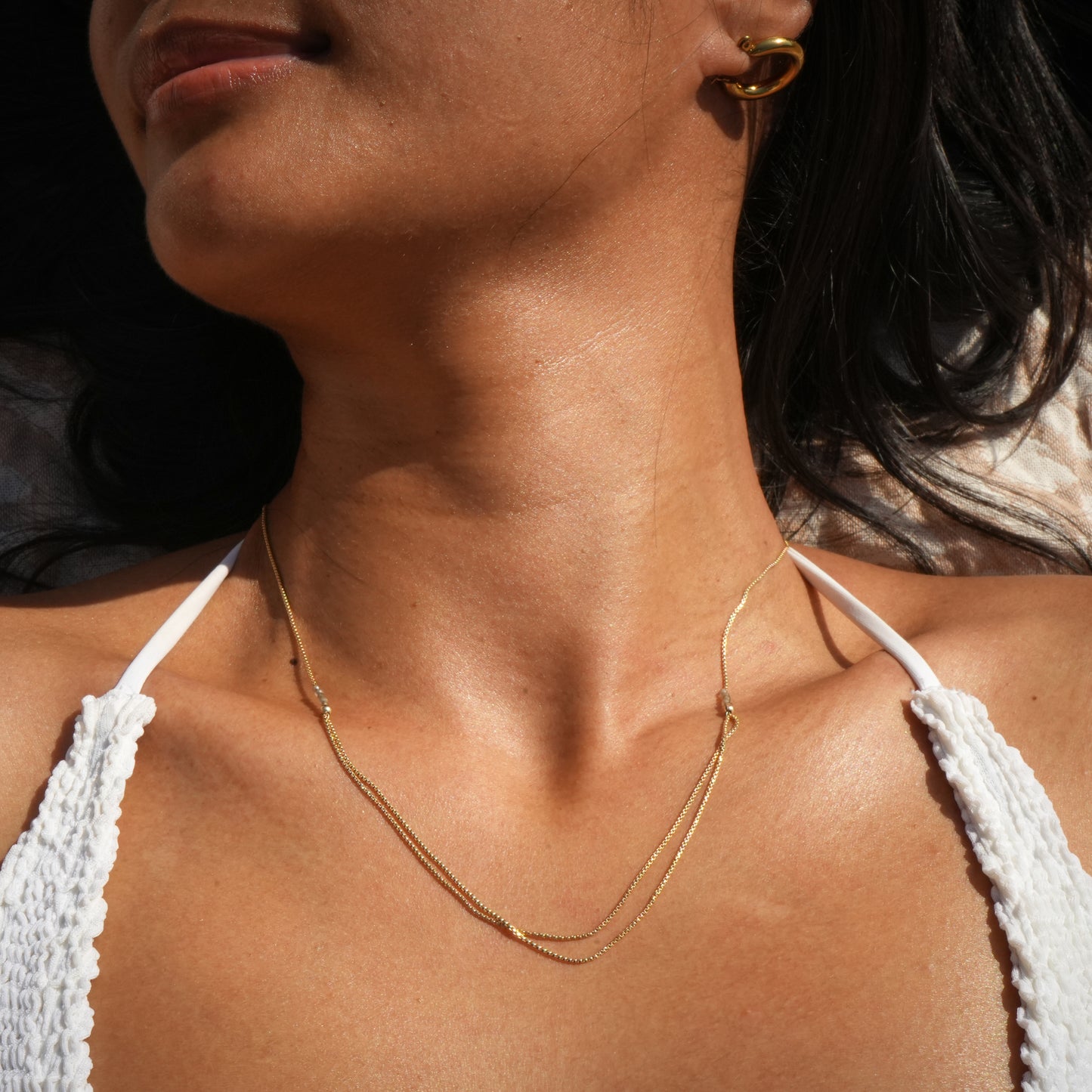 woman wearing necklace with gold-fill chain and citrine faceted stones
