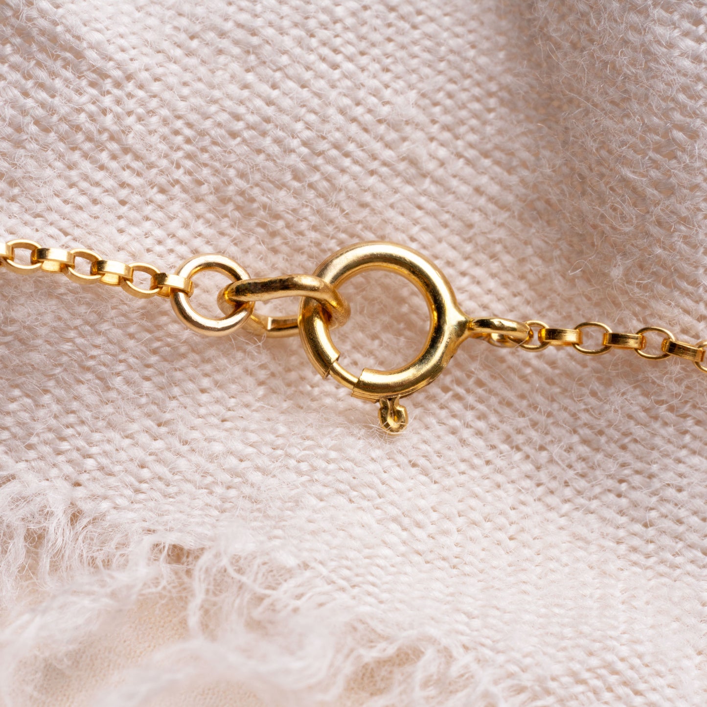 bracelet clasp on a white cloth