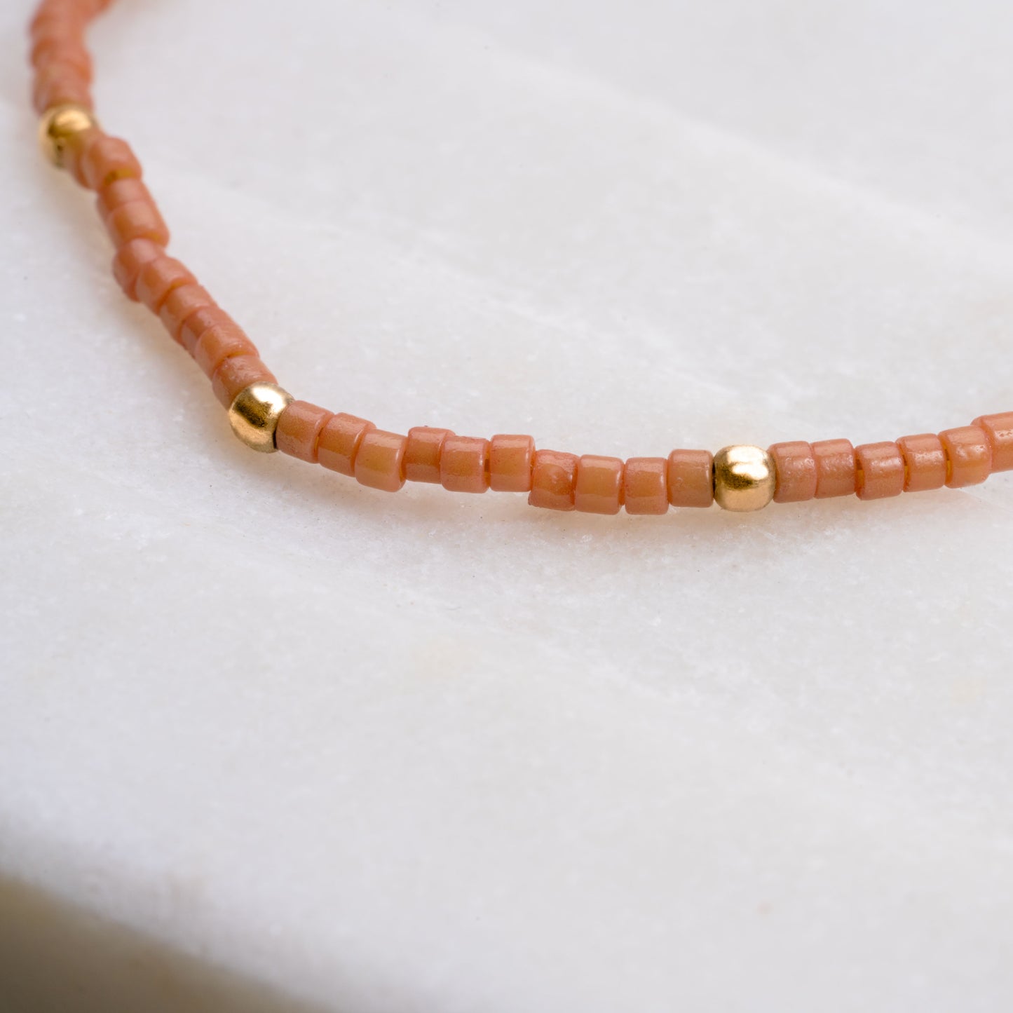 close up of necklace with brown miyuki glass beads