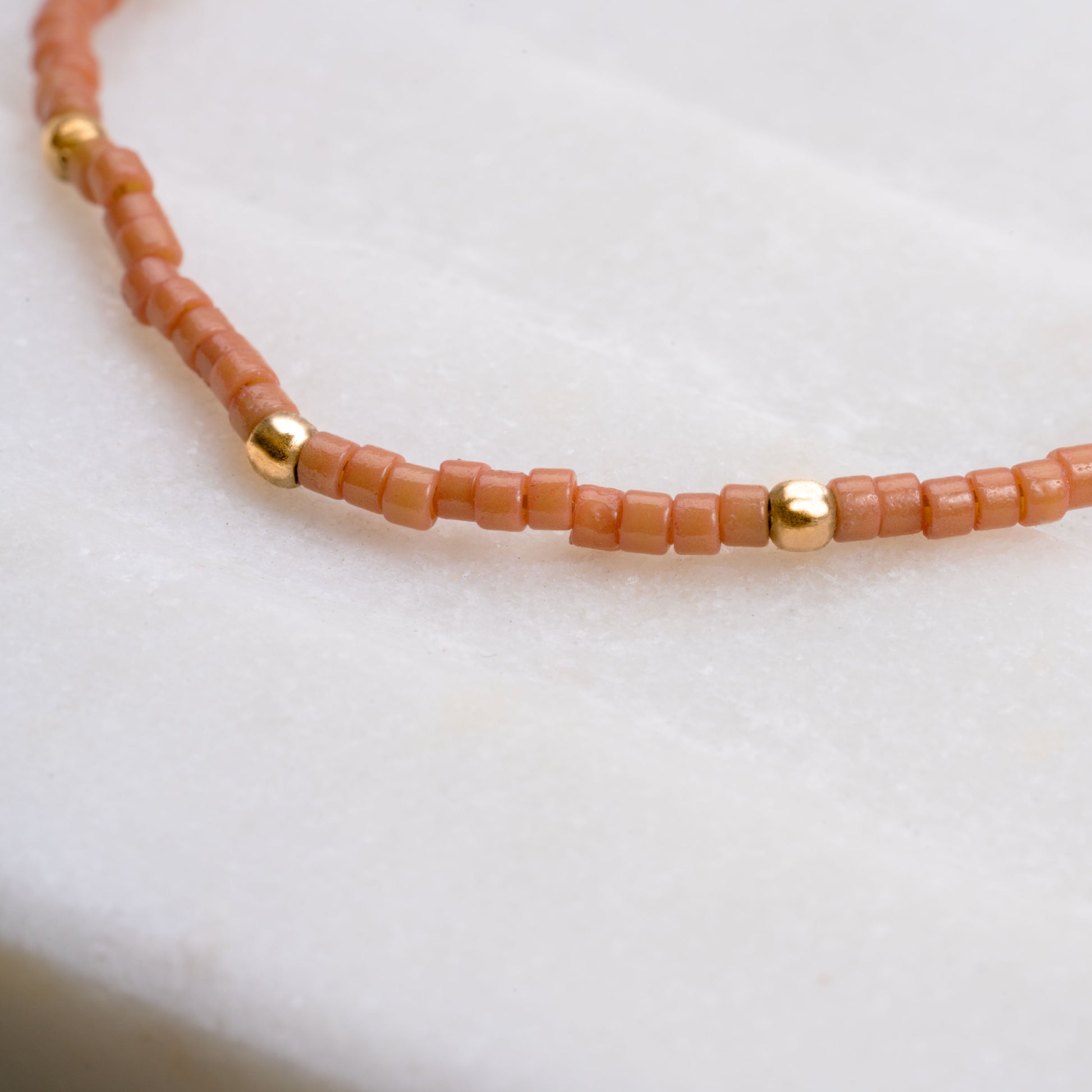 close up of necklace with brown miyuki glass beads
