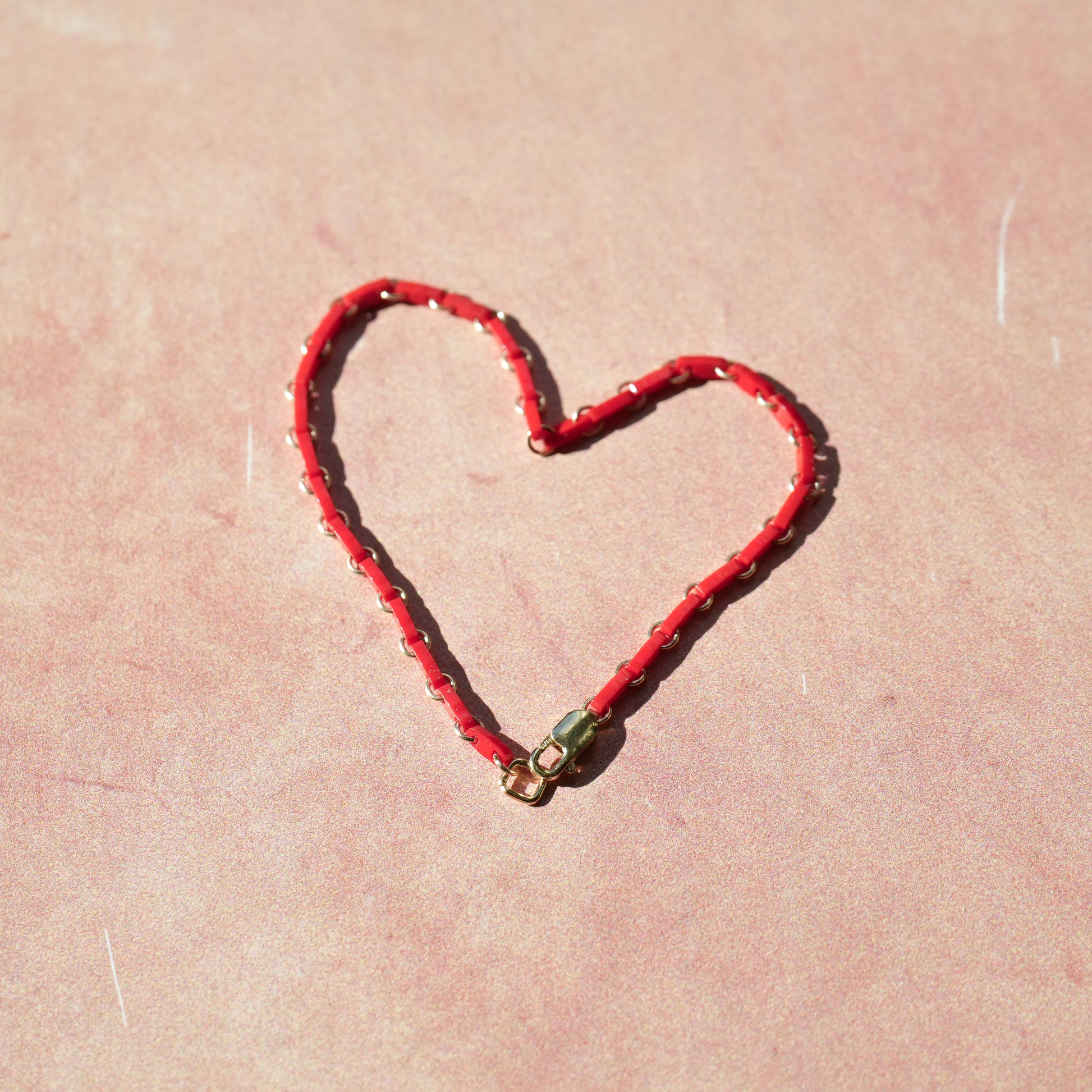 red Japanese glass bead bracelet in the shape of a heart