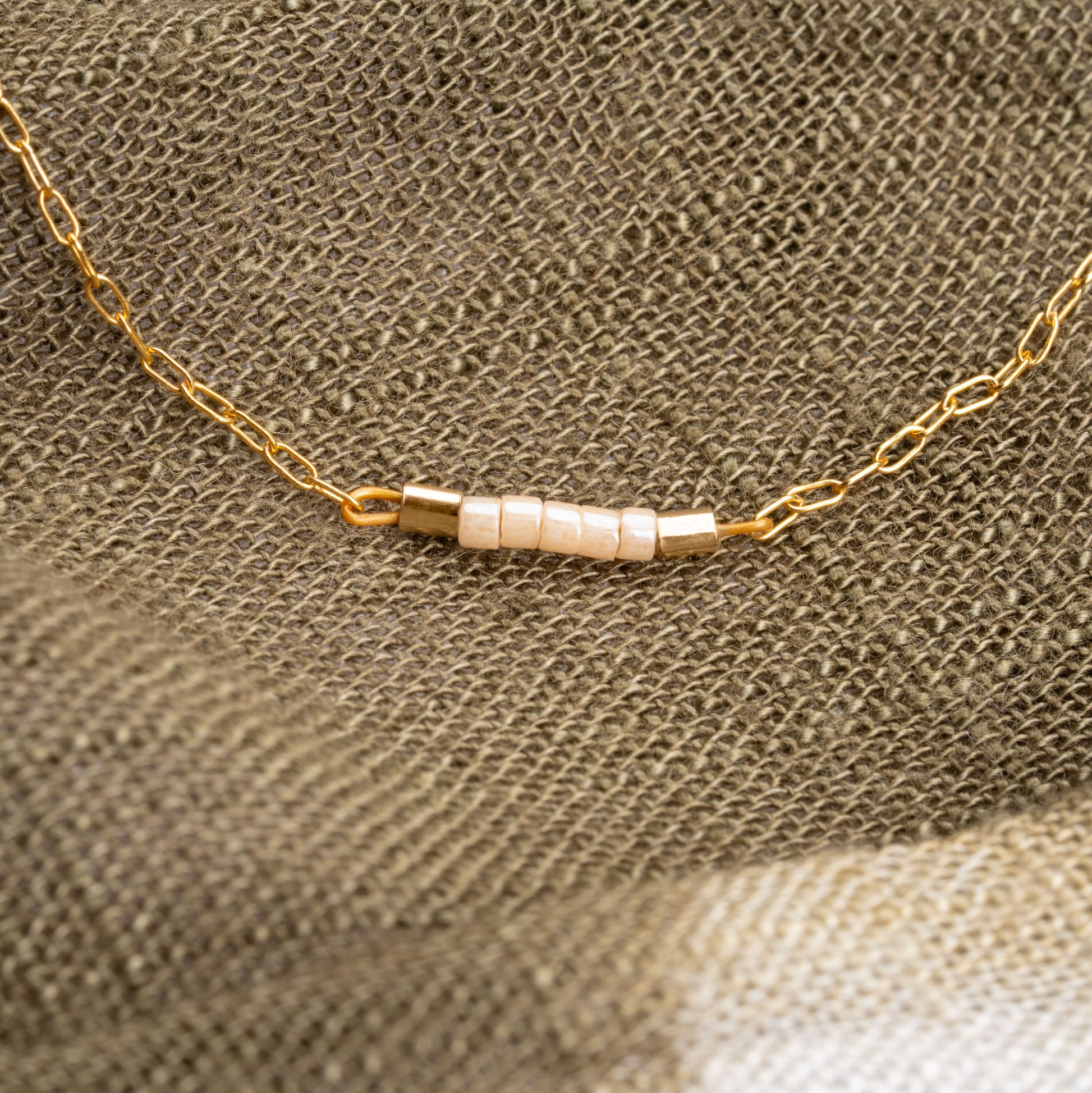 close up view of beads on a gold-fill chain