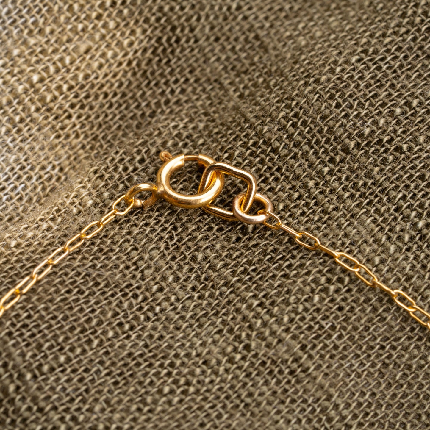 close up view of gold-fill clasp on a bracelet