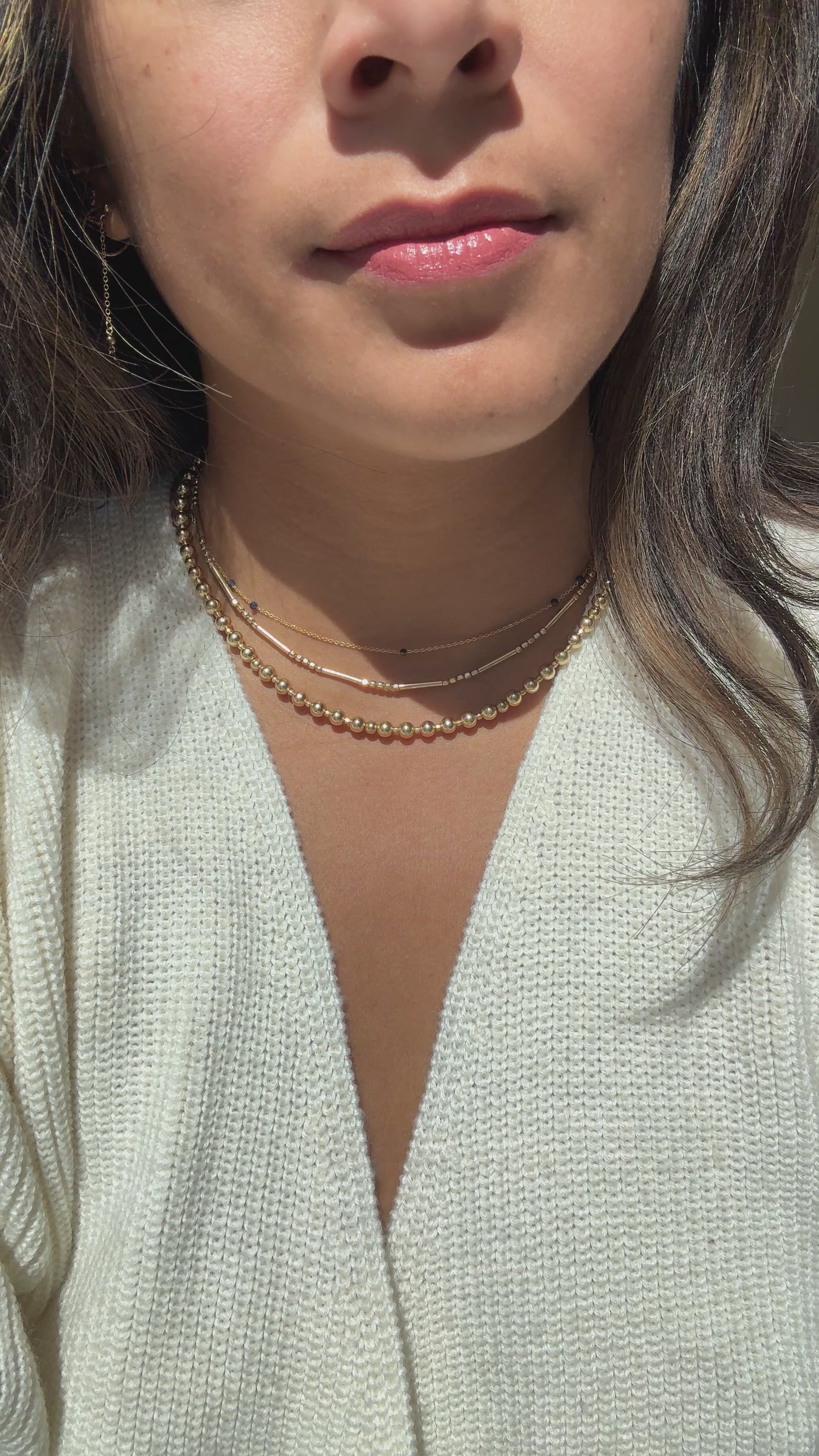 Video showing versatile ways to wear a gold-filled beaded necklace